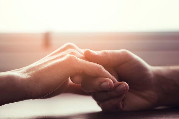 Couple holding hands making time for their relationship