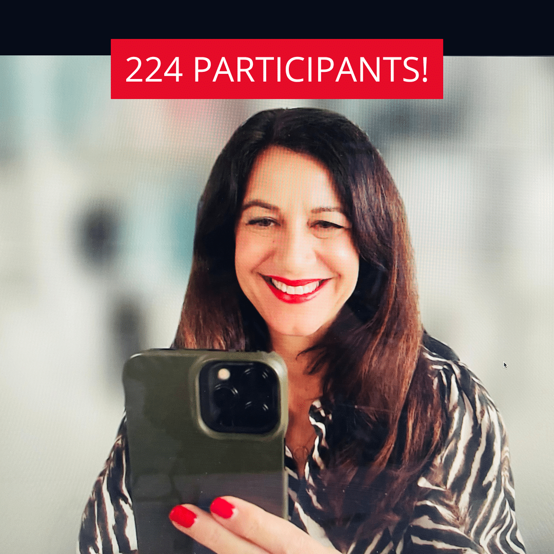 Life coach Katarina Stoltz smiling as she takes a screenshot during a zoom call during a coaching course to celebrate having 224 participants.