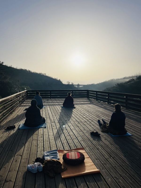The retreat group meditating during sunrise in Portugal. One of the practices that increased happiness.