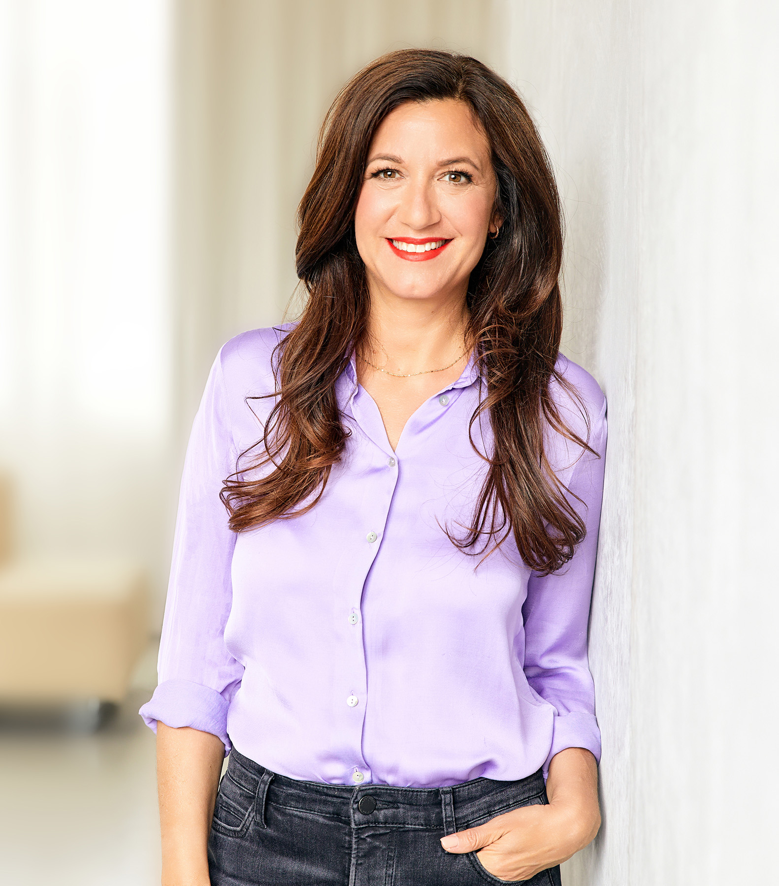 Life Coach and Therapist Katarina in a purple blouse smiling